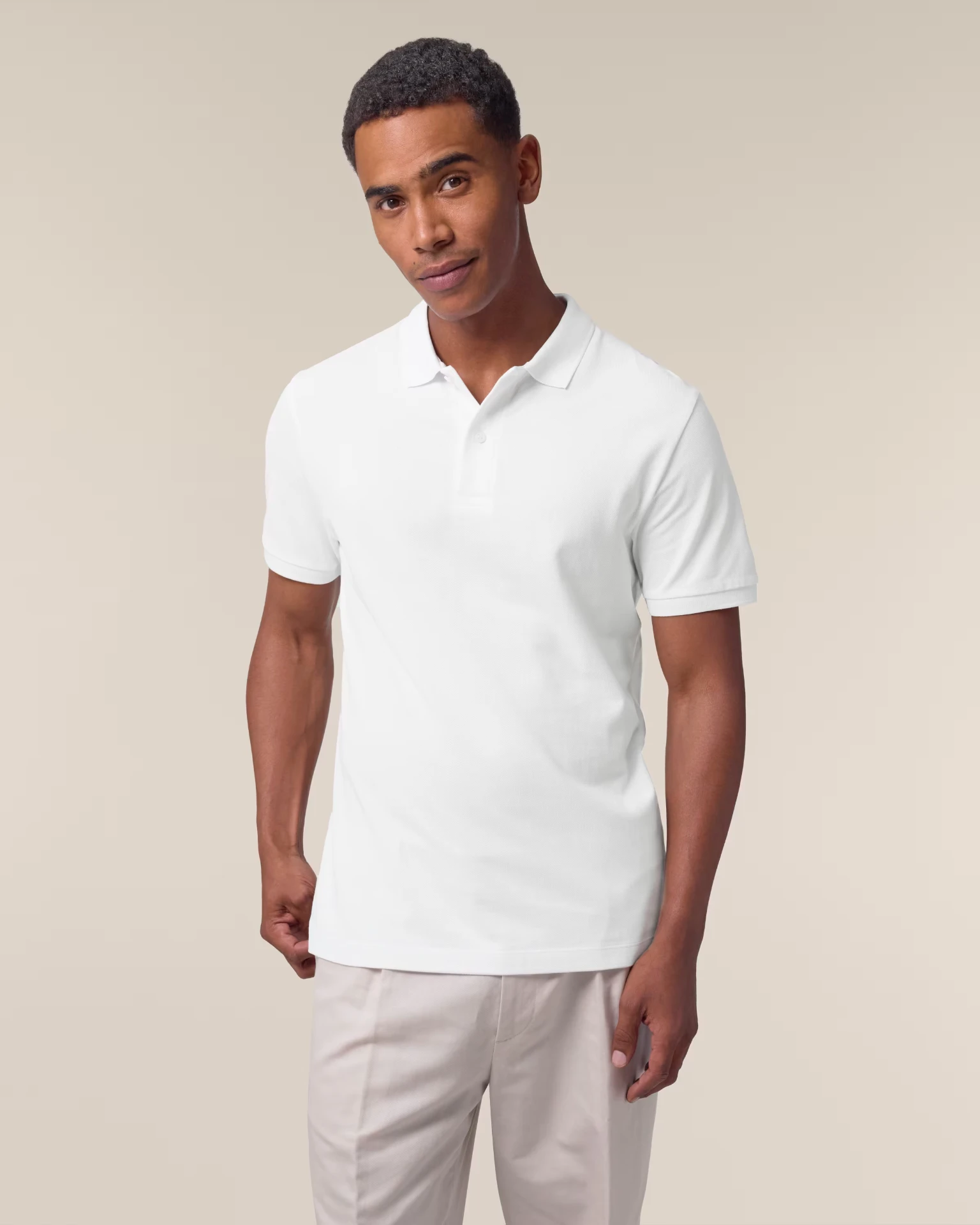 Custom branded piqué polo — white by REVEL