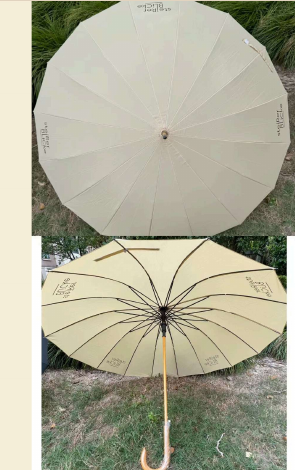 Cream golf umbrella from the REVEL production archive.